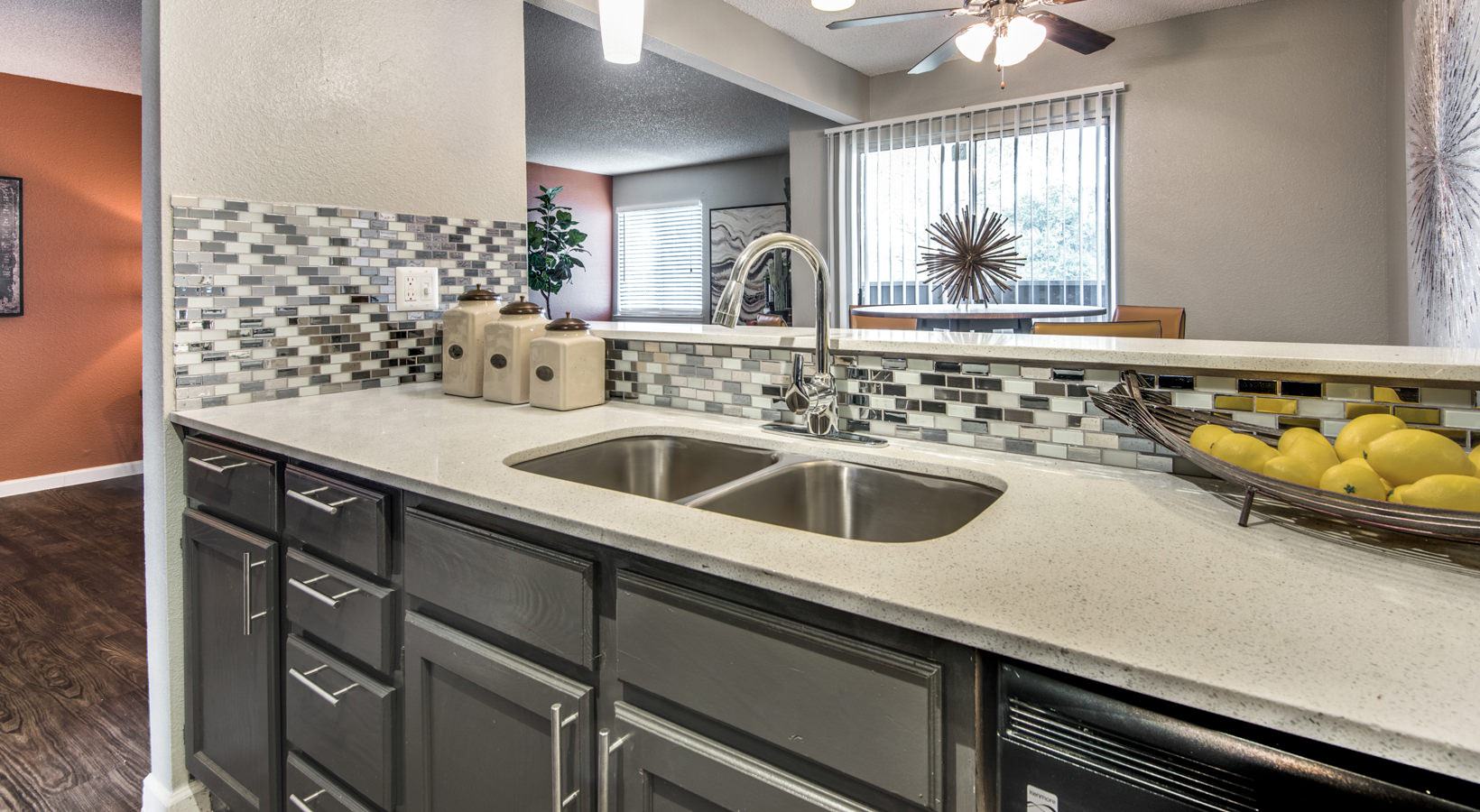 a kitchen with granite counter tops and stainless steel appliances at The  Mark at 2600