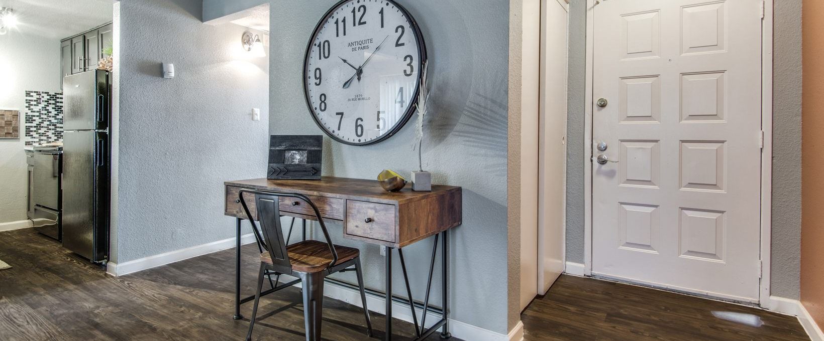 a clock is on the wall in this home at The  Mark at 2600